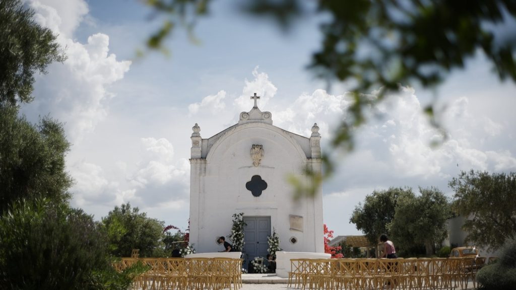 façade of the Masseria San Giovanni with a ceremony set up