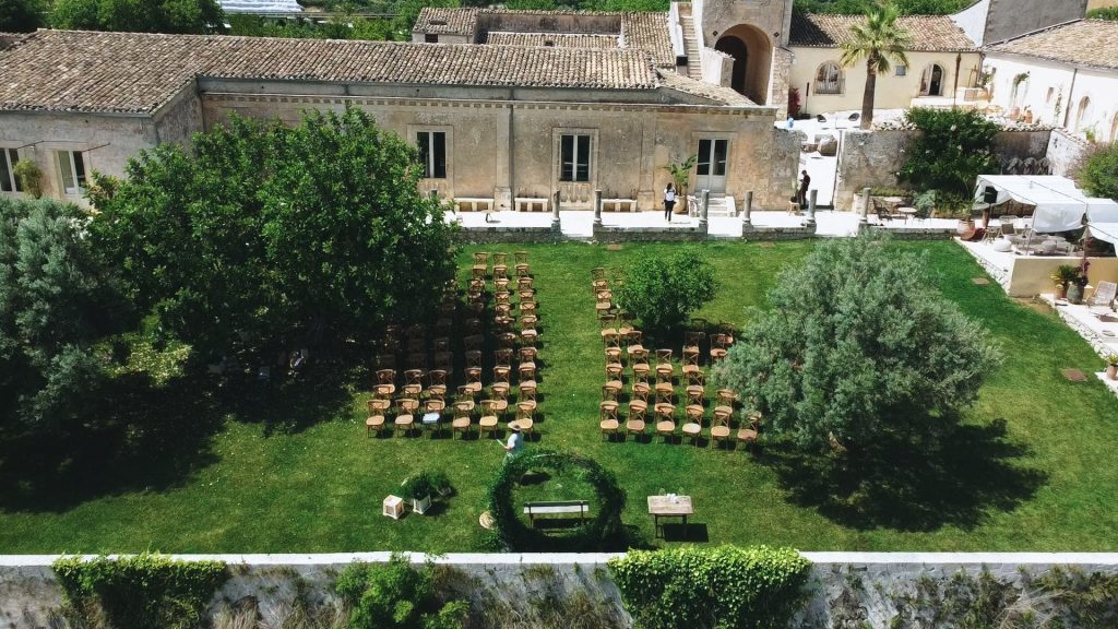 garden with green lawn in the rear part of the Dimora delle Balze with set up for symbolic ceremony