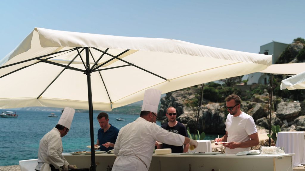 bbq by the sea. chefs serve guests