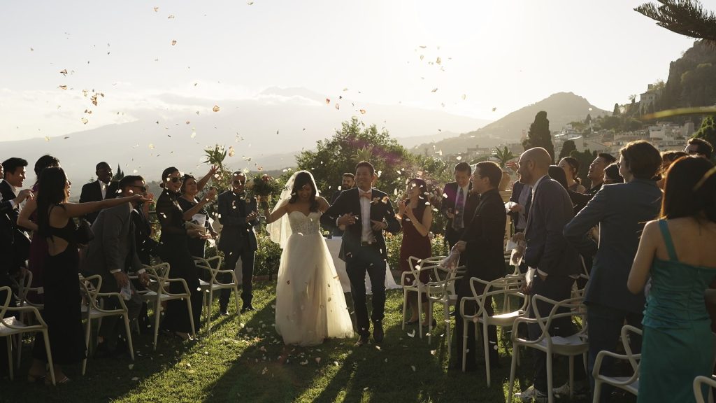 throwing rice after a symbolic ceremony on a terrace of the Hotel Timeo in Taormina