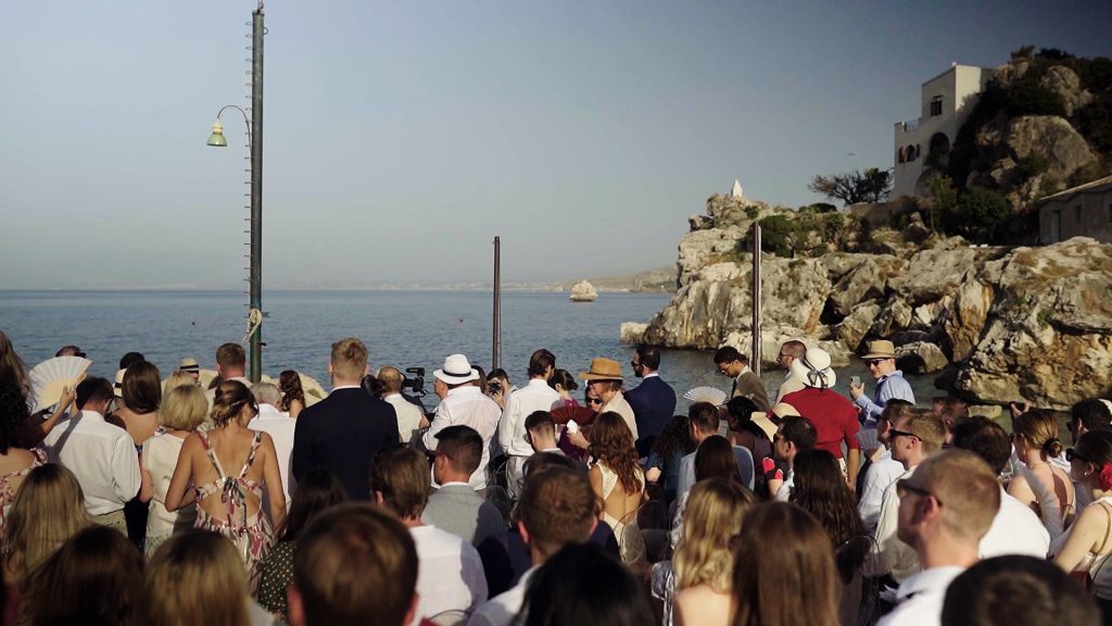 all the guests who attend Hubert and Natalie's destination wedding by the sea