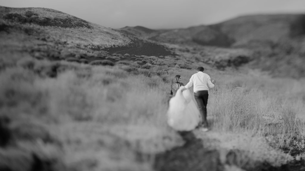 couple walking on the Etna Volcano